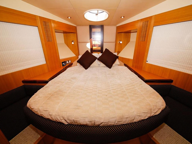 spacious bed room in our luxury yachts on rent in Dubai